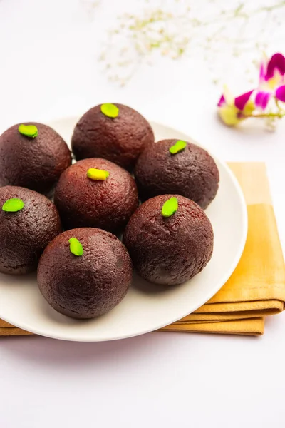 Indian Sweet Food Sweet Black Gulab Jamun Also Known as Kala Jamun, Black Jamun or Dry Kala Jam