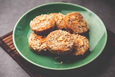 Amrit peda or Amrut pedha or pera is an Indian sweet made from milk and sugar with coconut topping