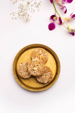 Amrit peda or Amrut pedha or pera is an Indian sweet made from milk and sugar with coconut topping