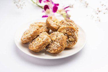 Amrit peda or Amrut pedha or pera is an Indian sweet made from milk and sugar with coconut topping