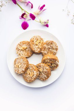 Amrit peda or Amrut pedha or pera is an Indian sweet made from milk and sugar with coconut topping