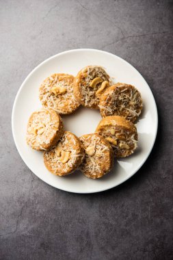 Amrit peda or Amrut pedha or pera is an Indian sweet made from milk and sugar with coconut topping