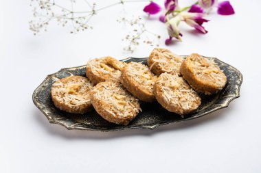 Amrit peda or Amrut pedha or pera is an Indian sweet made from milk and sugar with coconut topping