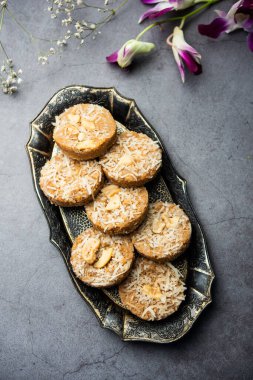 Amrit peda or Amrut pedha or pera is an Indian sweet made from milk and sugar with coconut topping