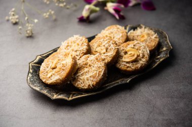 Amrit peda or Amrut pedha or pera is an Indian sweet made from milk and sugar with coconut topping