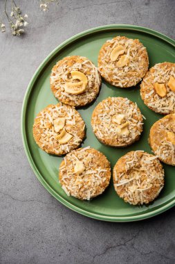 Amrit peda or Amrut pedha or pera is an Indian sweet made from milk and sugar with coconut topping
