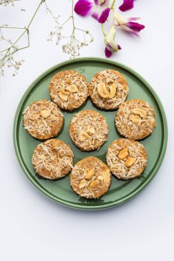 Amrit peda or Amrut pedha or pera is an Indian sweet made from milk and sugar with coconut topping