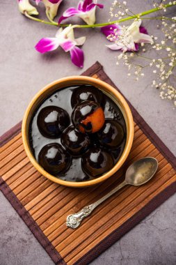 Chocolate dipped gulab jamun, indian creative fusion dessert food