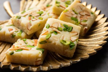 Milk powder barfi also known as Mava burfi, white Khoya burfi or Barfee, Indian Sweet food