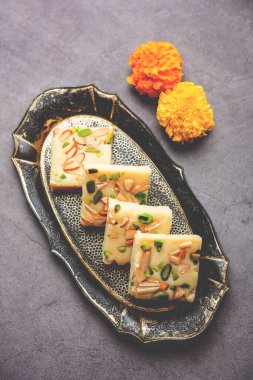Milk powder barfi also known as Mava burfi, white Khoya burfi or Barfee, Indian Sweet food