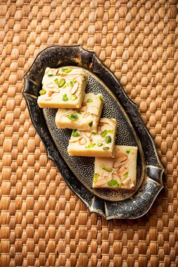 Milk powder barfi also known as Mava burfi, white Khoya burfi or Barfee, Indian Sweet food