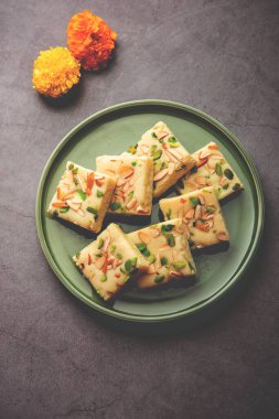 Milk powder barfi also known as Mava burfi, white Khoya burfi or Barfee, Indian Sweet food