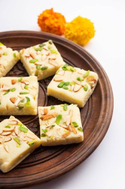 Milk powder barfi also known as Mava burfi, white Khoya burfi or Barfee, Indian Sweet food