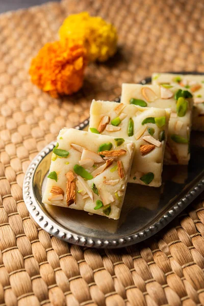 Milk powder barfi also known as Mava burfi, white Khoya burfi or Barfee, Indian Sweet food