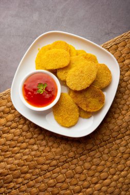 crispy potato rava fried slices or batatyache kaap or batata semolina fry snacks from India
