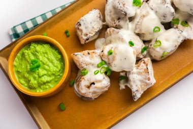 vegetarian soya malai chap made using soya chaap with white creamy gravy