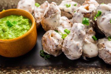 vegetarian soya malai chap made using soya chaap with white creamy gravy