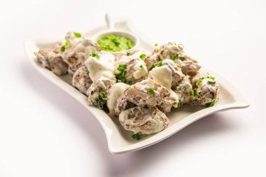 vegetarian soya malai chap made using soya chaap with white creamy gravy