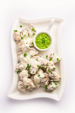 vegetarian soya malai chap made using soya chaap with white creamy gravy