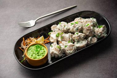 vegetarian soya malai chap made using soya chaap with white creamy gravy