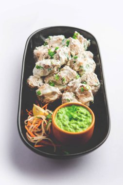 vegetarian soya malai chap made using soya chaap with white creamy gravy