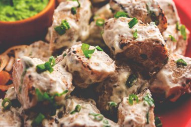 vegetarian soya malai chap made using soya chaap with white creamy gravy