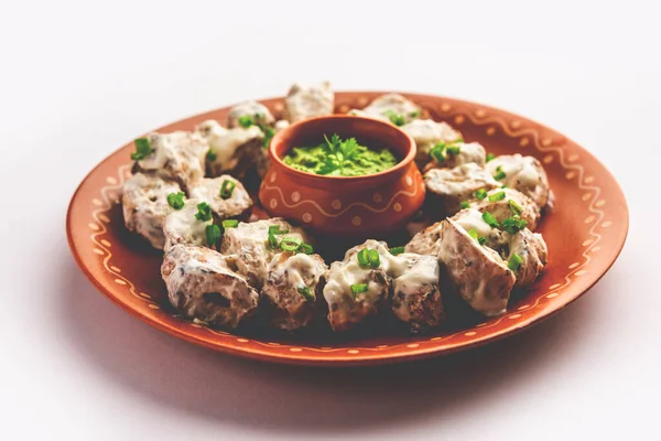 vegetarian soya malai chap made using soya chaap with white creamy gravy