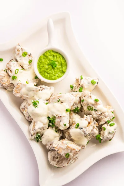 vegetarian soya malai chap made using soya chaap with white creamy gravy