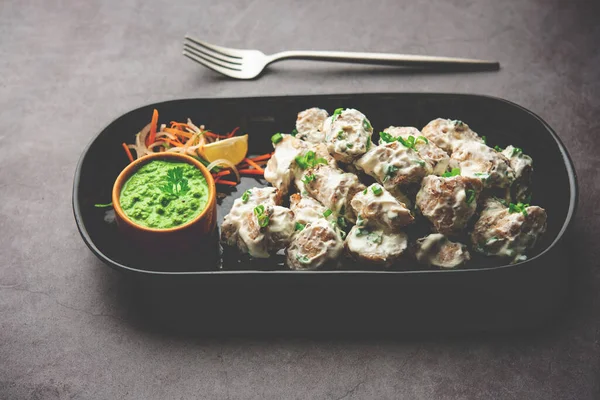 vegetarian soya malai chap made using soya chaap with white creamy gravy