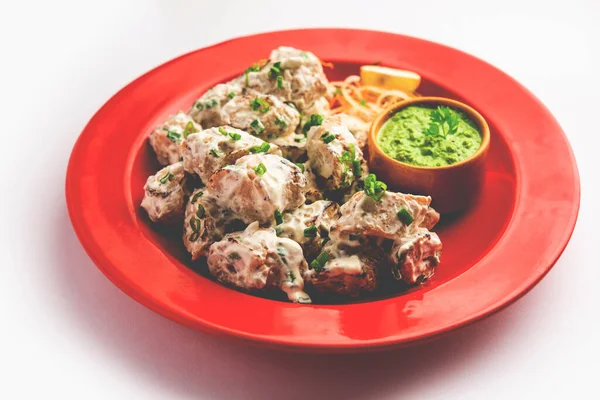 vegetarian soya malai chap made using soya chaap with white creamy gravy