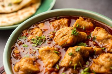 Punjabi soya chaap gravy or dhaba style soya chap masala sabzi served with naan