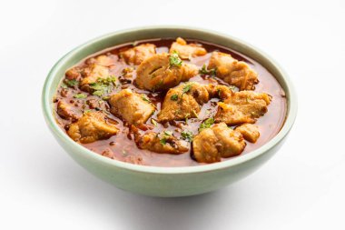 Punjabi soya chaap gravy or dhaba style soya chap masala sabzi served with naan