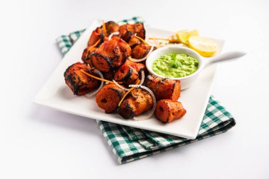 Tandoori Soya Chaap or soy chap dish prepared by marinating in tandoori spices, closeup view