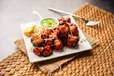 Tandoori Soya Chaap or soy chap dish prepared by marinating in tandoori spices, closeup view