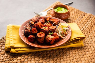 Tandoori Soya Chaap or soy chap dish prepared by marinating in tandoori spices, closeup view