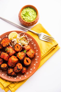 Tandoori Soya Chaap or soy chap dish prepared by marinating in tandoori spices, closeup view