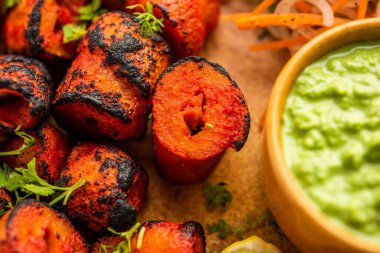 Tandoori Soya Chaap or soy chap dish prepared by marinating in tandoori spices, closeup view