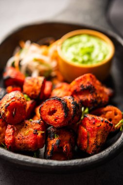 Tandoori Soya Chaap or soy chap dish prepared by marinating in tandoori spices, closeup view