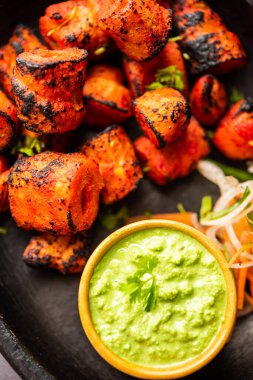 Tandoori Soya Chaap or soy chap dish prepared by marinating in tandoori spices, closeup view
