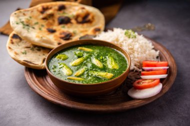 palak baby corn sabzi also known as spinach makai curry served with rice or roti, Indian food