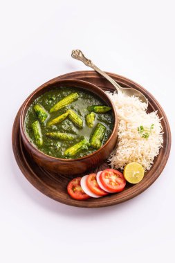 palak baby corn sabzi also known as spinach makai curry served with rice or roti, Indian food