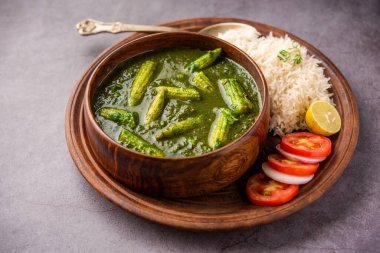 palak baby corn sabzi also known as spinach makai curry served with rice or roti, Indian food