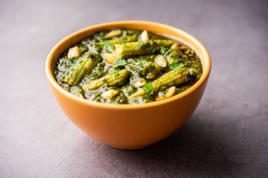 palak baby corn sabzi also known as spinach makai curry served with rice or roti, Indian food
