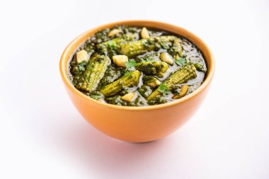palak baby corn sabzi also known as spinach makai curry served with rice or roti, Indian food