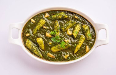 palak baby corn sabzi also known as spinach makai curry served with rice or roti, Indian food
