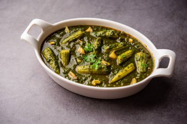palak baby corn sabzi also known as spinach makai curry served with rice or roti, Indian food