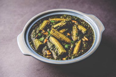 palak baby corn sabzi also known as spinach makai curry served with rice or roti, Indian food