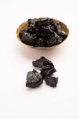 Shilajit is an ayurvedic medicine found primarily in the rocks of the Himalayas. selective focus