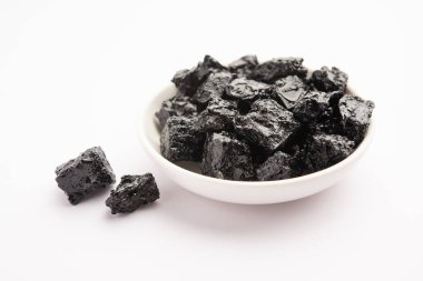 Shilajit is an ayurvedic medicine found primarily in the rocks of the Himalayas. selective focus