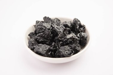 Shilajit is an ayurvedic medicine found primarily in the rocks of the Himalayas. selective focus
